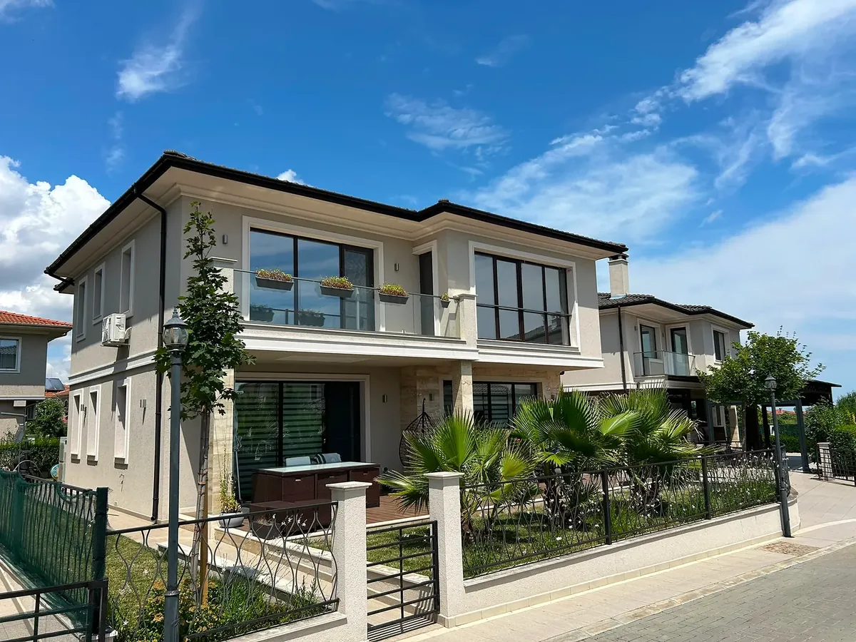 Exterior with balcony, palm trees and fence, villa in the Hill South quarter, Victoria development near Pomorie