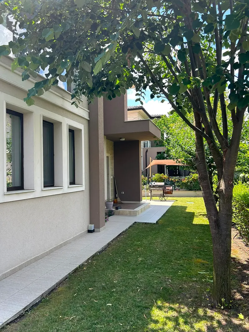 Garden with lawn and tree beside the house, villa in the Hill South quarter, Victoria development near Pomorie