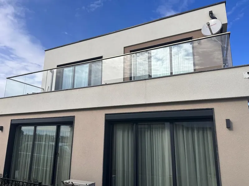 Exterior with glass balcony on the upper floor, villa in the Summerset quarter, Victoria development near Pomorie