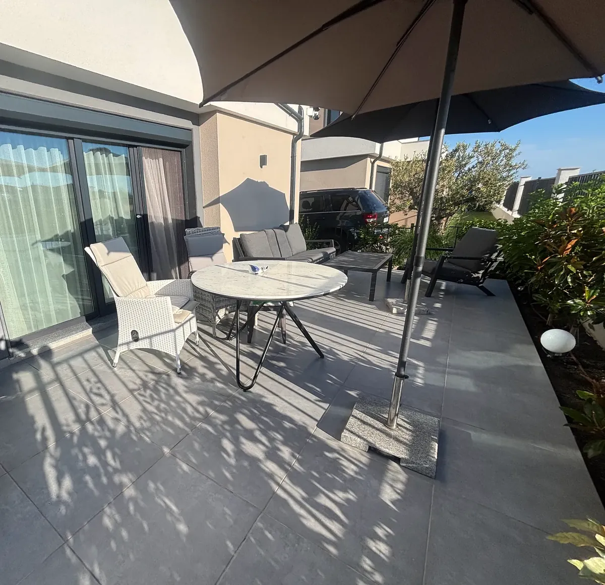 Terrace with seating and parasol, villa in the Summerset quarter, Victoria development near Pomorie