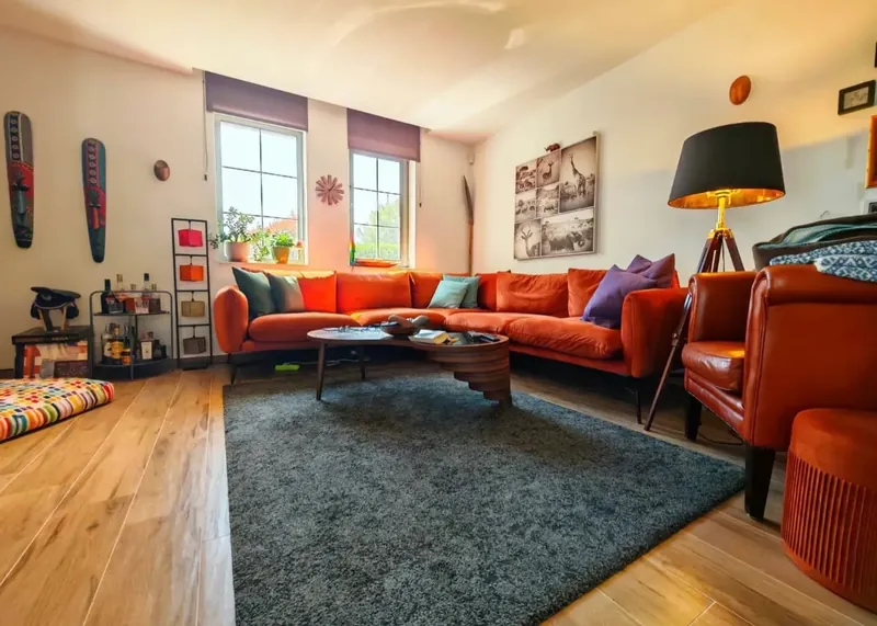 Living room with corner sofa, rug and floor lamp, villa in the Victoria Lakes quarter, Victoria development near Pomorie