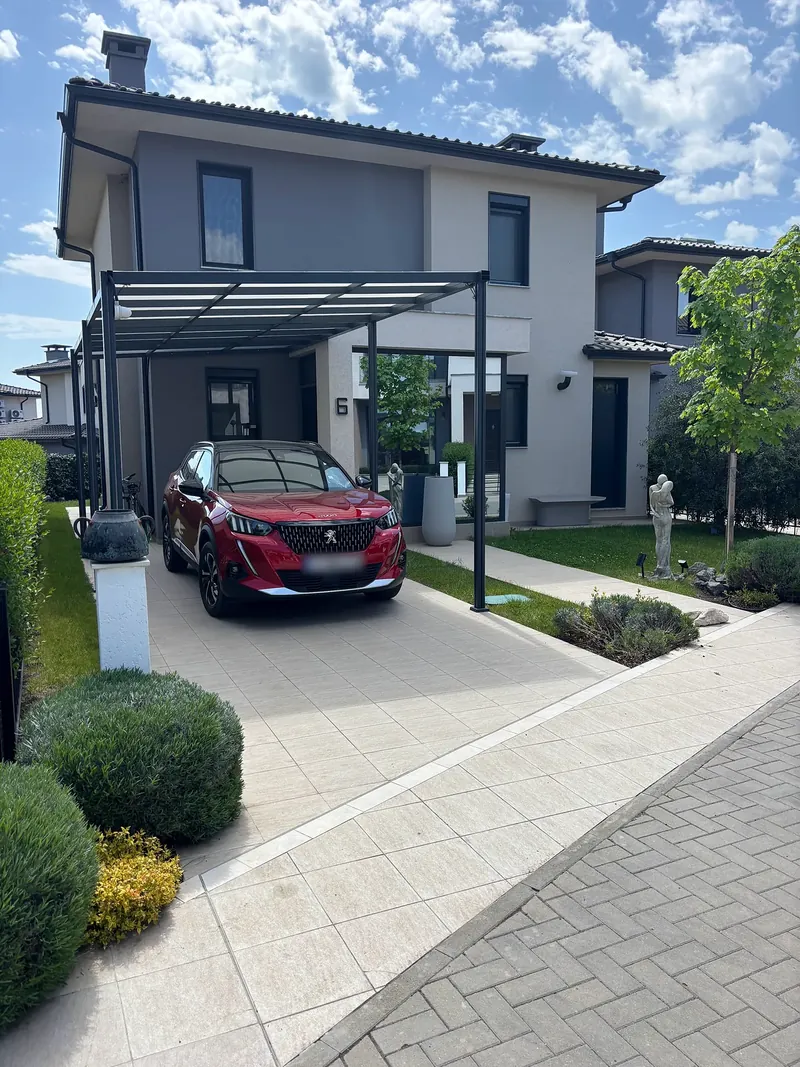 Driveway with carport in front of the house, villa in the Victoria Sunrise quarter, Victoria development near Pomorie