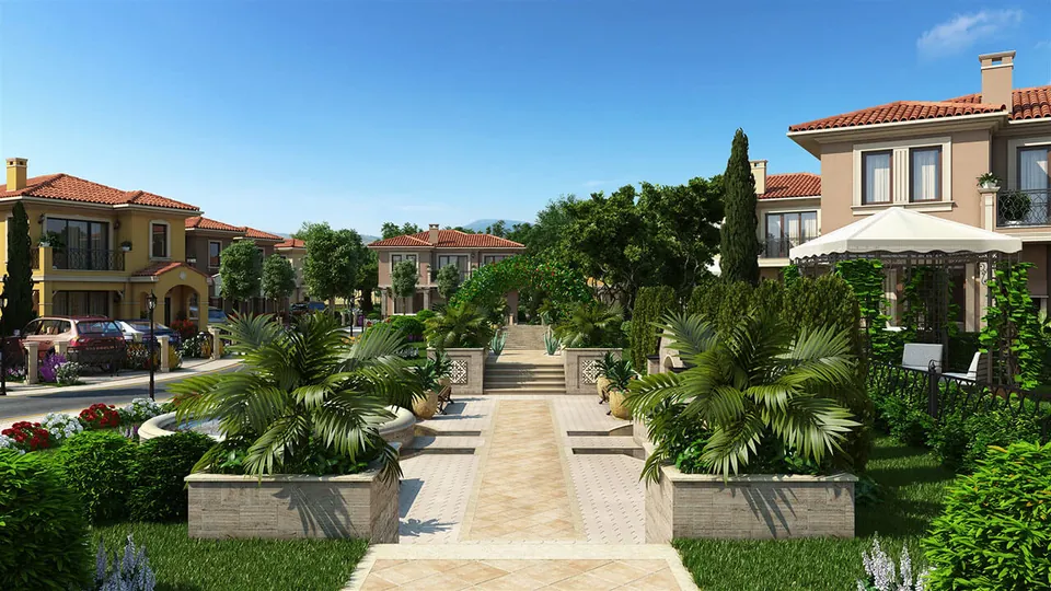 Promenade with palm trees between the villas